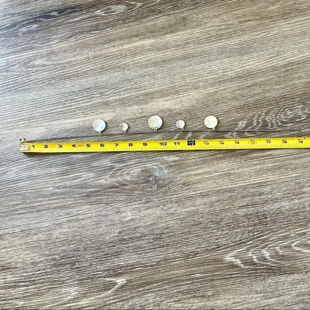 Silver tone disc necklace